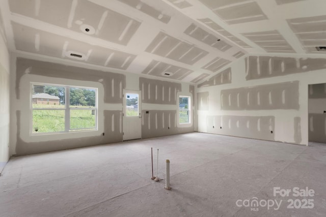 2508 Rock Dam Rd, Lincolnton, NC 28092 - unfurnished living room with healthy amount of natural light and vaulted ceiling
