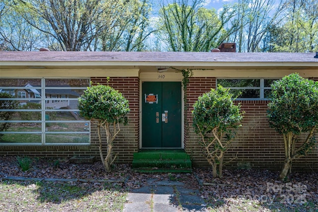 340 Sardis Rd N, Charlotte, NC 28270 - doorway to property featuring brick siding