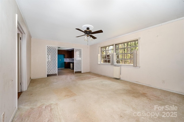 340 Sardis Rd N, Charlotte, NC 28270 - carpeted spare room with ornamental molding, radiator, baseboards, and ceiling fan