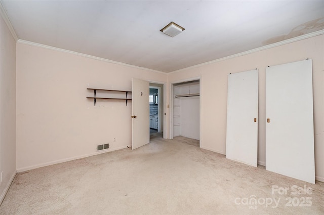 340 Sardis Rd N, Charlotte, NC 28270 - unfurnished bedroom featuring visible vents, multiple closets, ornamental molding, and carpet flooring