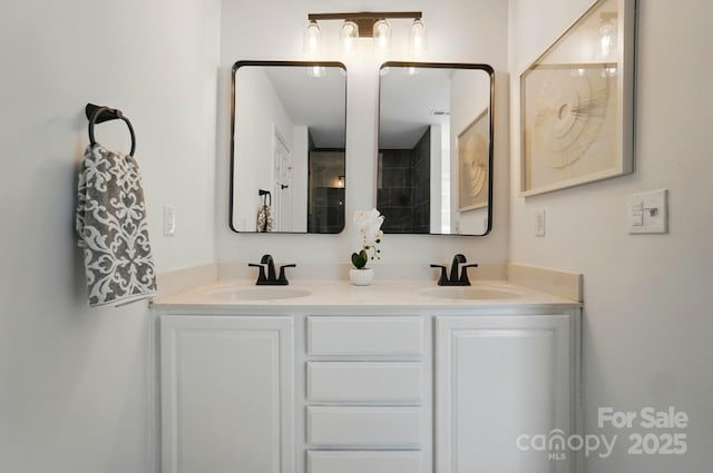 full bath with double vanity and a sink