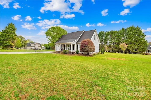 view of front of house featuring a front lawn and concrete driveway