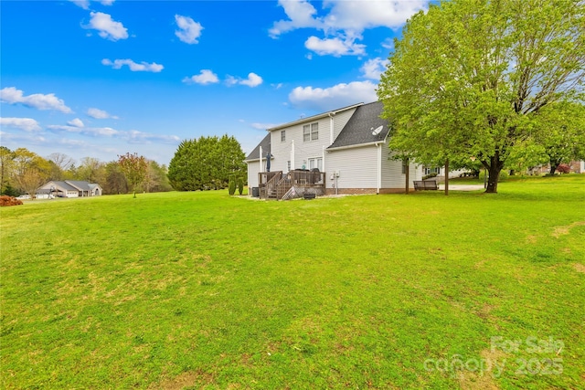 view of yard featuring a wooden deck