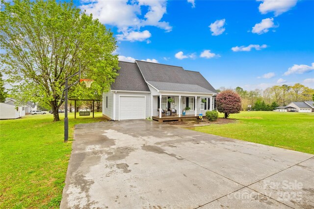 view of front facade with a front yard, roof with shingles, concrete driveway, a garage, and a porch