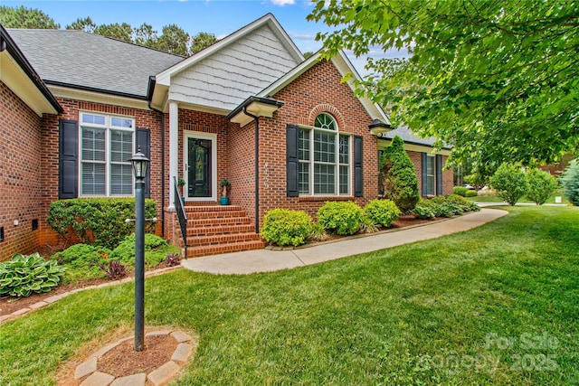 4159 Isle Of Pines Dr, Denver, NC 28037 - view of front of house featuring brick siding, a front yard, and a shingled roof
