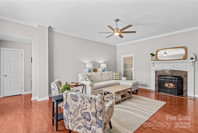 4159 Isle Of Pines Dr, Denver, NC 28037 - living area with a ceiling fan, ornamental molding, wood finished floors, a high end fireplace, and baseboards