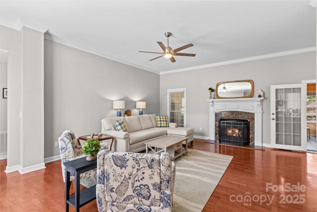 4159 Isle Of Pines Dr, Denver, NC 28037 - living area featuring a ceiling fan, crown molding, wood finished floors, a high end fireplace, and baseboards