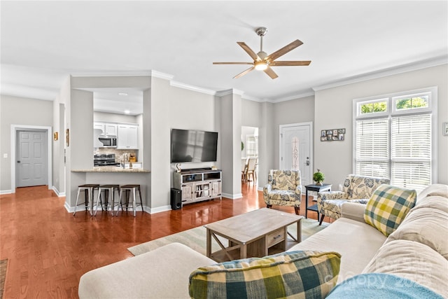 4159 Isle Of Pines Dr, Denver, NC 28037 - living area featuring ceiling fan, dark wood finished floors, baseboards, and crown molding