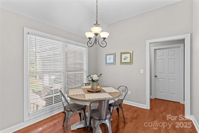 4159 Isle Of Pines Dr, Denver, NC 28037 - dining space featuring a chandelier, baseboards, and wood finished floors