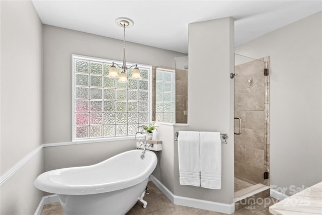 4159 Isle Of Pines Dr, Denver, NC 28037 - full bath featuring a stall shower, baseboards, a freestanding bath, a chandelier, and tile patterned floors