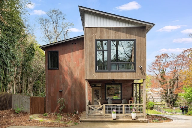 exterior space featuring fence and covered porch