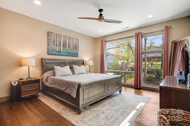 bedroom with recessed lighting, baseboards, visible vents, and hardwood / wood-style flooring