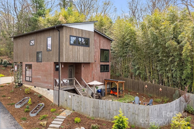 exterior space featuring crawl space and fence