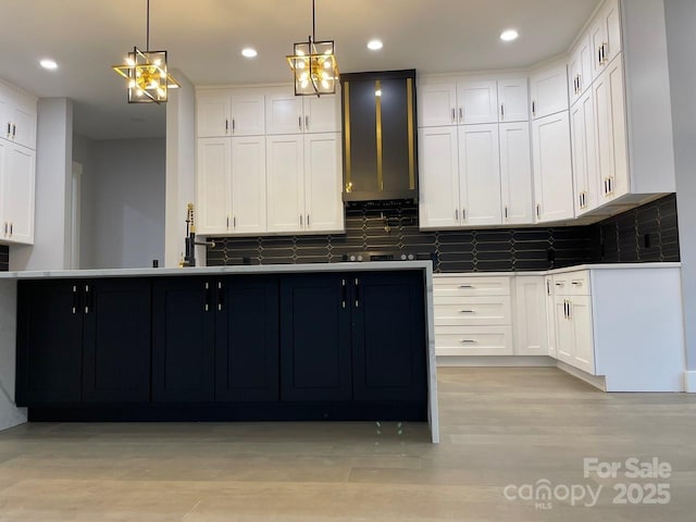 27 George Allen Rdg, Arden, NC 28704 - kitchen featuring decorative backsplash, white cabinets, pendant lighting, recessed lighting, and light wood-style flooring