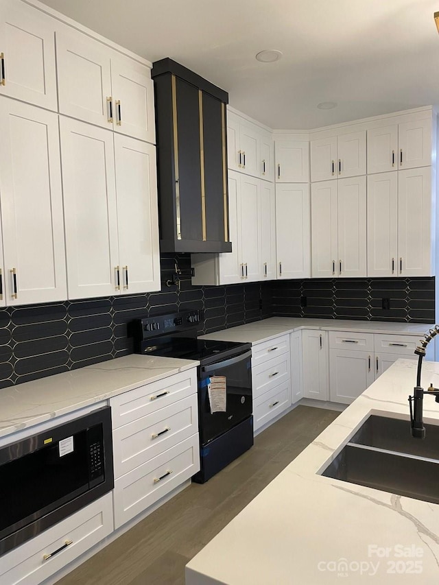 27 George Allen Rdg, Arden, NC 28704 - kitchen featuring black appliances, white cabinets, and decorative backsplash
