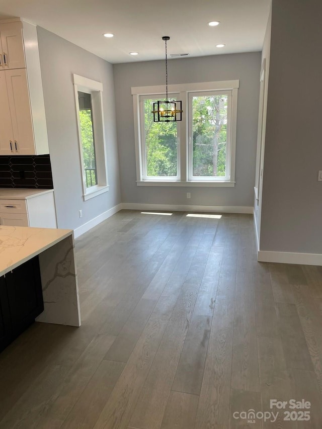 27 George Allen Rdg, Arden, NC 28704 - unfurnished dining area with baseboards, a chandelier, wood finished floors, and recessed lighting