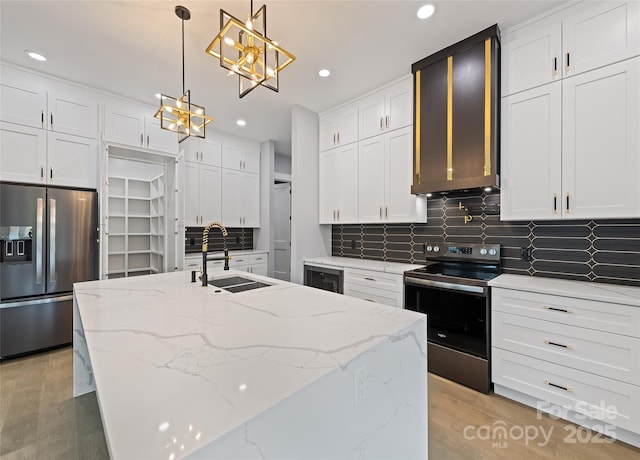 27 George Allen Rdg, Arden, NC 28704 - kitchen with appliances with stainless steel finishes, a chandelier, tasteful backsplash, white cabinetry, and recessed lighting