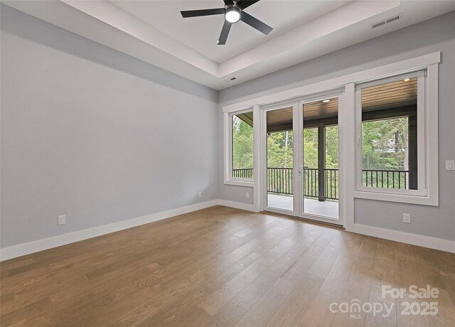 27 George Allen Rdg, Arden, NC 28704 - unfurnished room with a ceiling fan, wood finished floors, and a raised ceiling