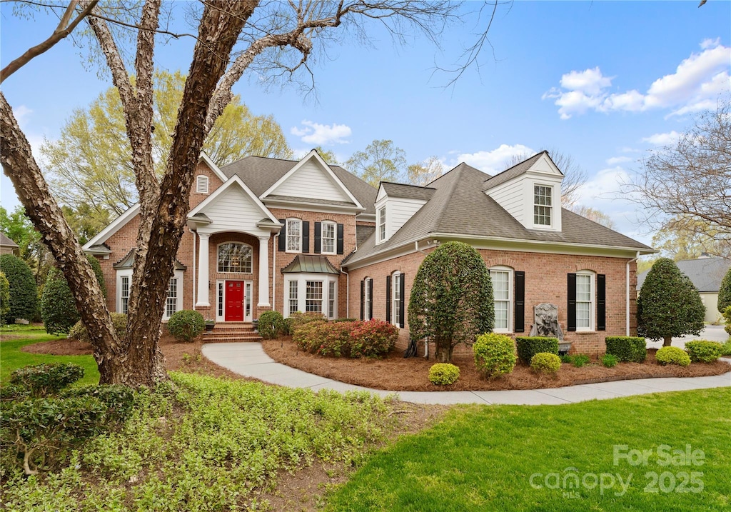 10809 Wicklow Brook Ct, Charlotte, NC 28277 - view of front of property with brick siding, a front lawn, and roof with shingles