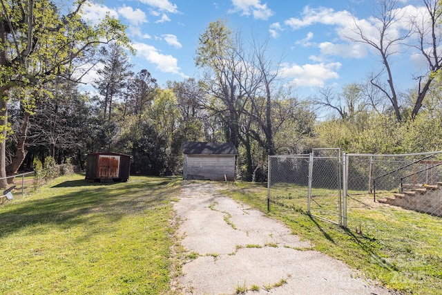 view of road featuring aphalt driveway and a gate