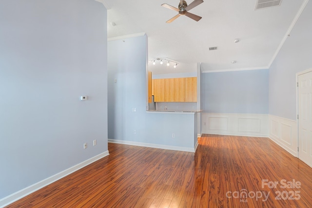 1000 Olde Eastwood Village Blvd Unit 307, Asheville, NC 28803 - spare room featuring crown molding, a wainscoted wall, ceiling fan, visible vents, and wood finished floors