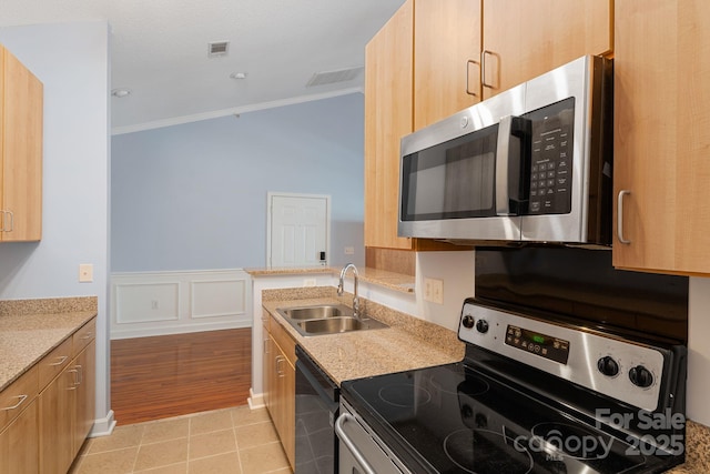 1000 Olde Eastwood Village Blvd Unit 307, Asheville, NC 28803 - kitchen with a wainscoted wall, visible vents, crown molding, appliances with stainless steel finishes, and a sink