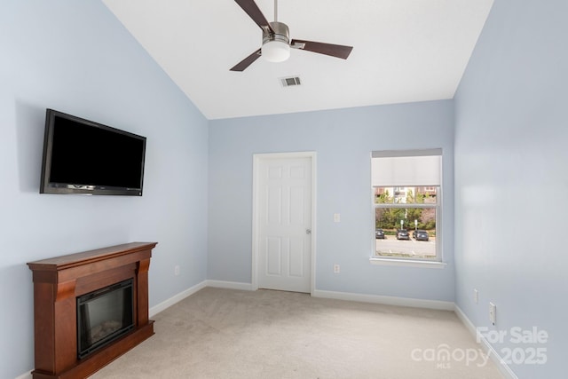 1000 Olde Eastwood Village Blvd Unit 307, Asheville, NC 28803 - unfurnished living room with light carpet, lofted ceiling, baseboards, visible vents, and ceiling fan