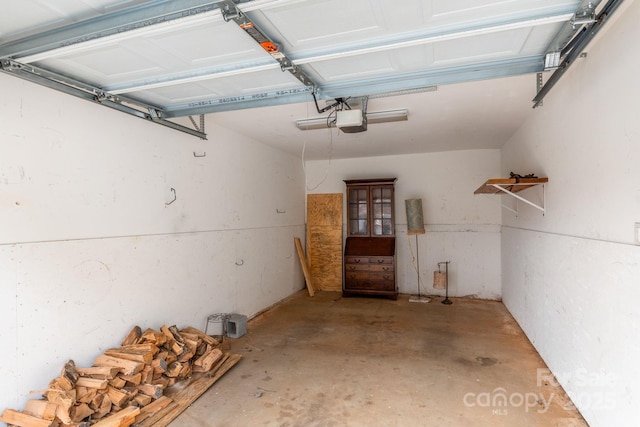 1000 Olde Eastwood Village Blvd Unit 307, Asheville, NC 28803 - garage featuring a garage door opener