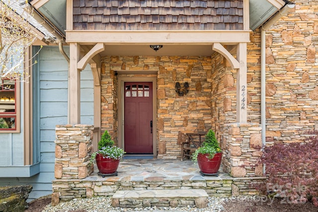 entrance to property with stone siding