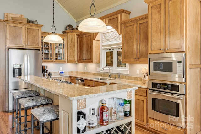 kitchen featuring open shelves, light wood-style floors, a sink, appliances with stainless steel finishes, and vaulted ceiling
