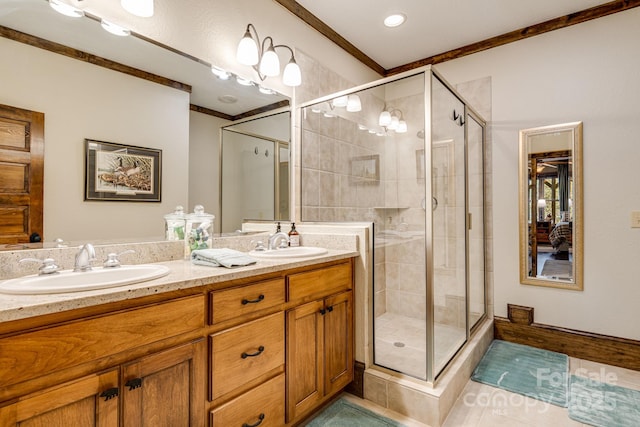 bathroom with double vanity, a sink, and a stall shower