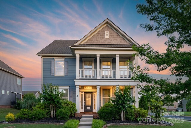 3013 Kensley Dr, Waxhaw, NC 28173 - view of front facade with a balcony and covered porch