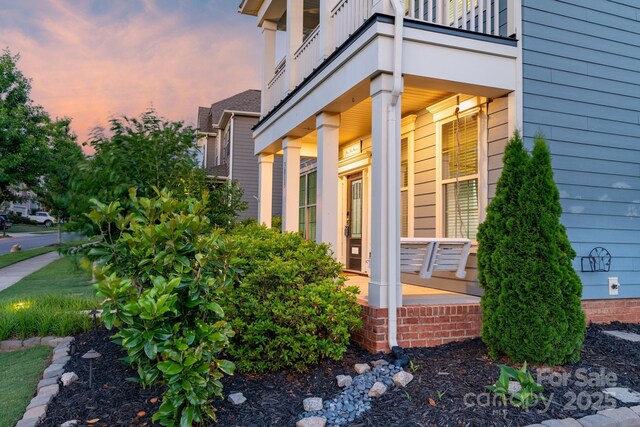 3013 Kensley Dr, Waxhaw, NC 28173 - property exterior at dusk featuring a balcony
