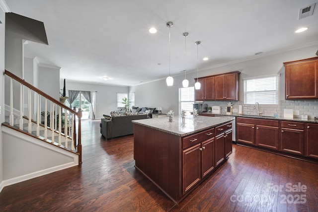 1718 Still River Way, Fort Mill, SC 29708 - kitchen with decorative backsplash, visible vents, a sink, and dark wood finished floors
