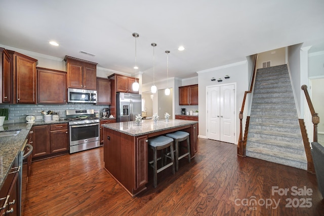 1718 Still River Way, Fort Mill, SC 29708 - kitchen with visible vents, backsplash, appliances with stainless steel finishes, and dark wood-style floors