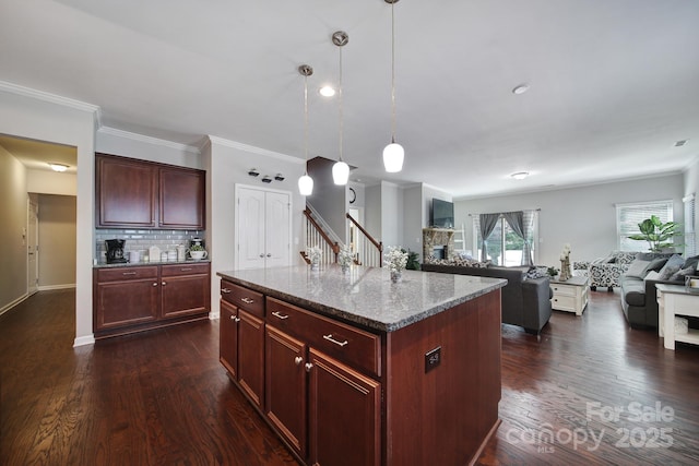 1718 Still River Way, Fort Mill, SC 29708 - kitchen featuring open floor plan, reddish brown cabinets, decorative backsplash, and dark wood finished floors