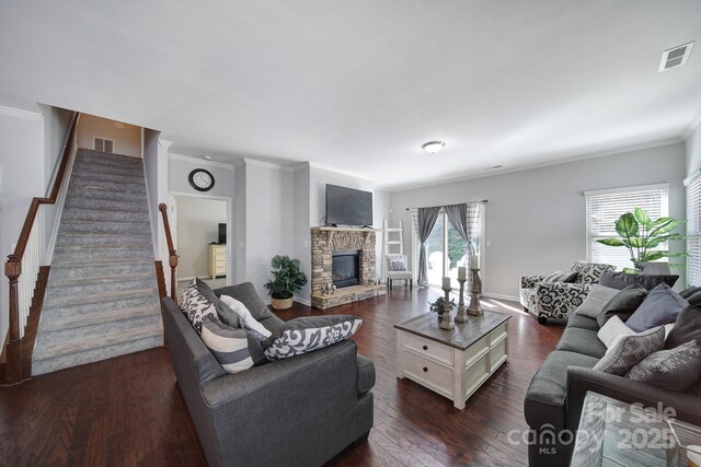 1718 Still River Way, Fort Mill, SC 29708 - living room with stairs, visible vents, a stone fireplace, and dark wood-style floors