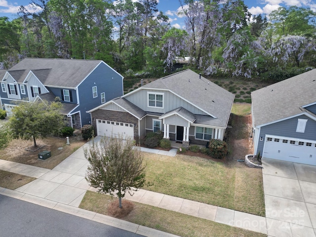 1718 Still River Way, Fort Mill, SC 29708 - traditional home featuring board and batten siding, a garage, roof with shingles, a front yard, and driveway