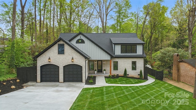 view of front of property with concrete driveway, fence, an attached garage, board and batten siding, and a front lawn