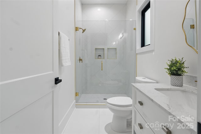 bathroom featuring a marble finish shower, toilet, tile patterned flooring, and vanity