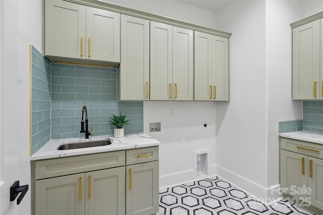 laundry room with hookup for a washing machine, baseboards, a sink, cabinet space, and electric dryer hookup