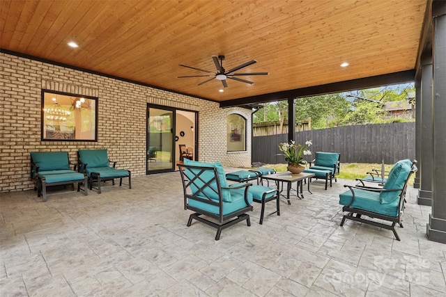 view of patio with a ceiling fan, an outdoor hangout area, and fence