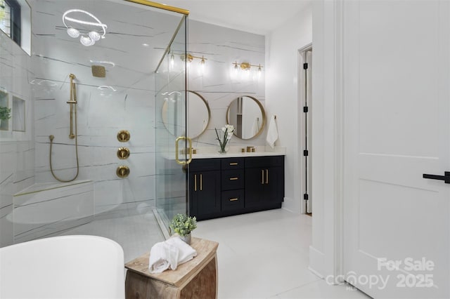 full bath with a marble finish shower, a freestanding tub, and vanity
