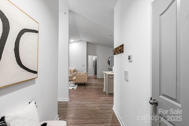 17143 Red Feather Dr, Charlotte, NC 28277 - corridor featuring dark wood-type flooring, baseboards, and vaulted ceiling