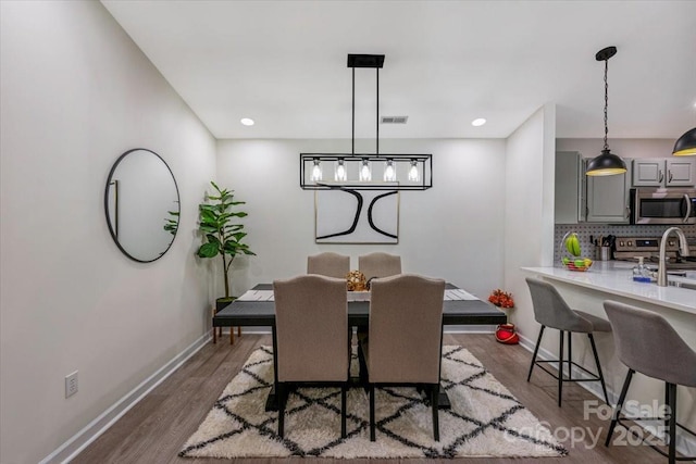 17143 Red Feather Dr, Charlotte, NC 28277 - dining area featuring dark wood-type flooring, baseboards, visible vents, and recessed lighting