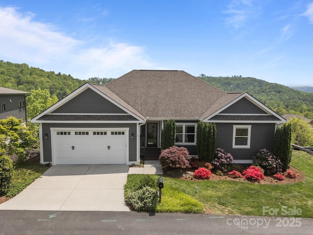 9 Endless View Dr, Weaverville, NC 28787 - view of front of home with a shingled roof, driveway, an attached garage, and a front yard