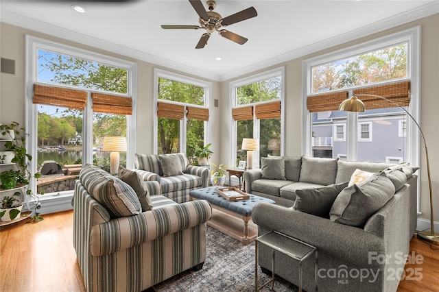 19040 Mary Ardrey Cir, Cornelius, NC 28031 - living room with crown molding, wood finished floors, ceiling fan, and a water view
