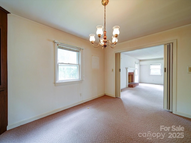 167 Cedar Ln, Troutman, NC 28166 - carpeted empty room featuring a chandelier and baseboards