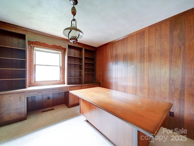 167 Cedar Ln, Troutman, NC 28166 - unfurnished office featuring built in study area, wood walls, light colored carpet, and built in shelves