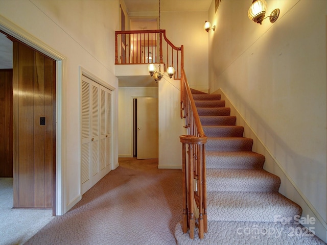 167 Cedar Ln, Troutman, NC 28166 - stairs featuring carpet and a high ceiling